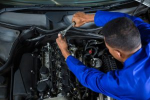 mechanic servicing a car